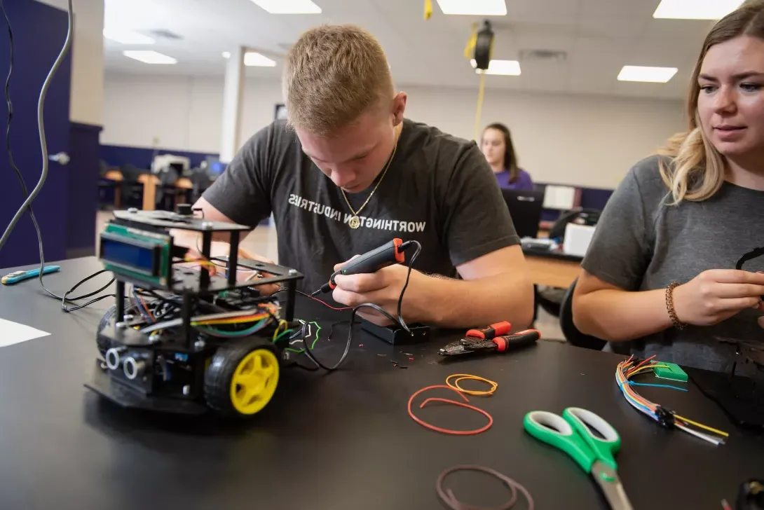 Eagle Consulting Group member working on a robot kit