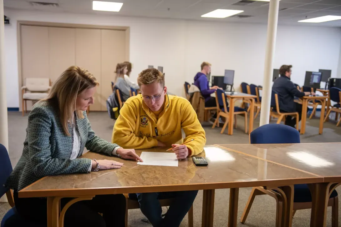 Student reviewing testing procedure with instructor